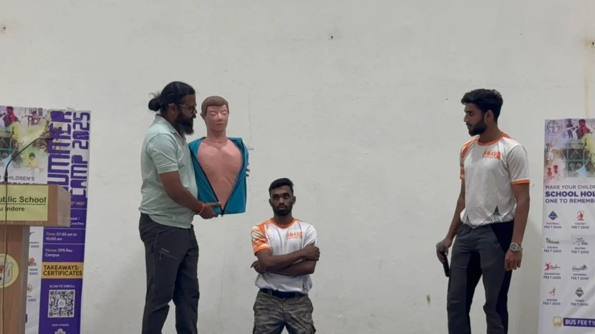 Students practicing CPR on mannequins during classroom session