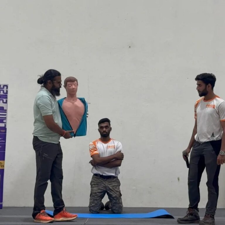 Students practicing CPR on mannequins during classroom session