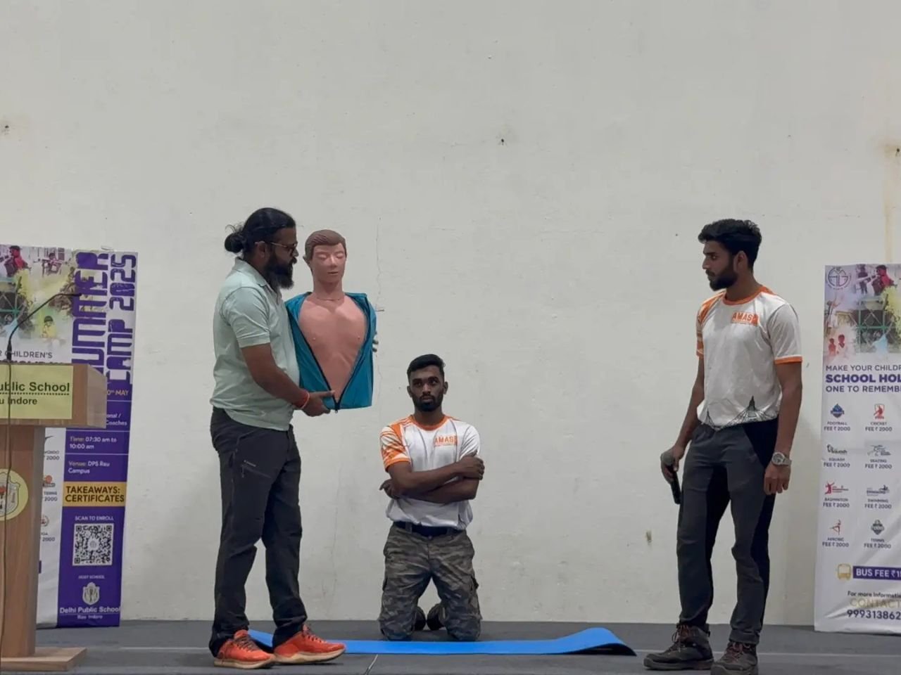 Students practicing CPR on mannequins during classroom session